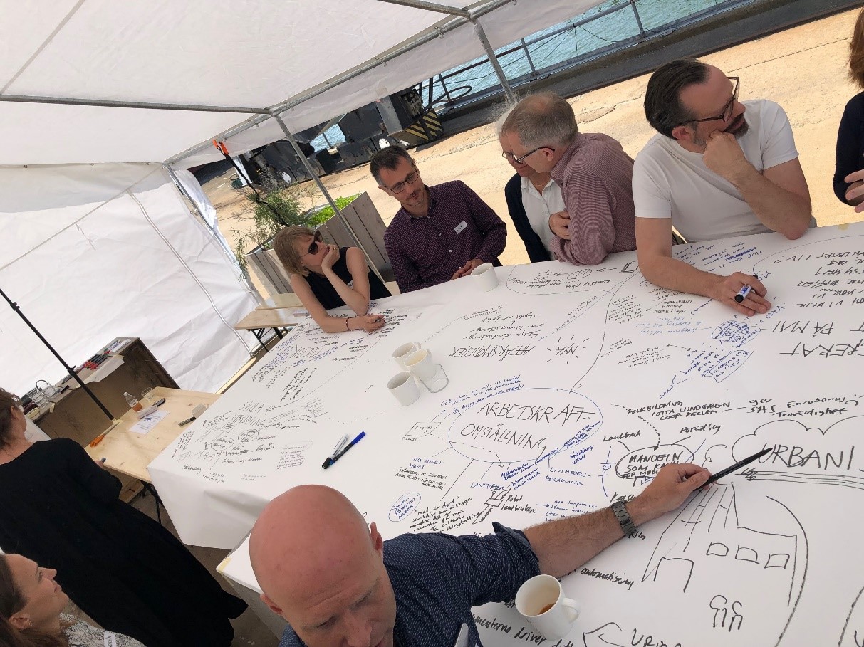 People at a table having a workshop